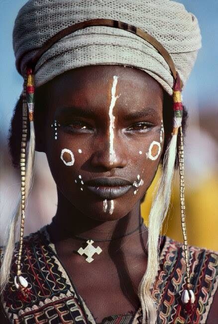 beautiful African woman with white paint on her face